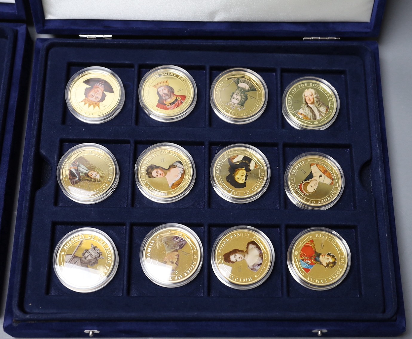 Two sets of Westminster coins in blue cases